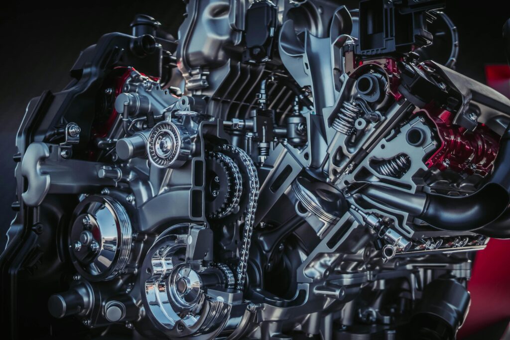 Detailed close-up of a modern metallic car engine with intricate components.
